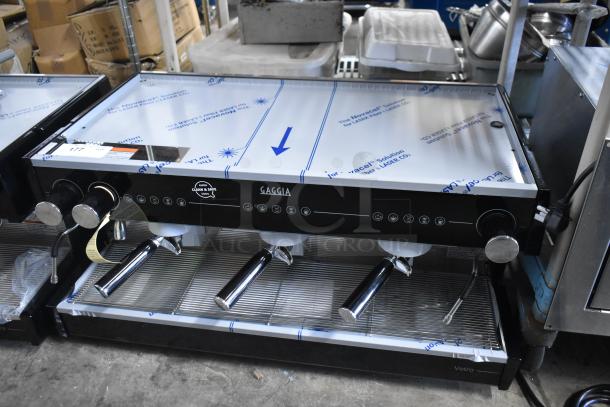 Brand new Gaggia MGV293NPU Vetro Black 3 Group Automatic Espresso Machine, 220/230V, scratch and dent condition.