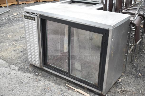 Continental BBUC50S-SS-SGD Back Bar Cooler, 115 Volts, glass sliding doors, visible wear, suitable for commercial use.
