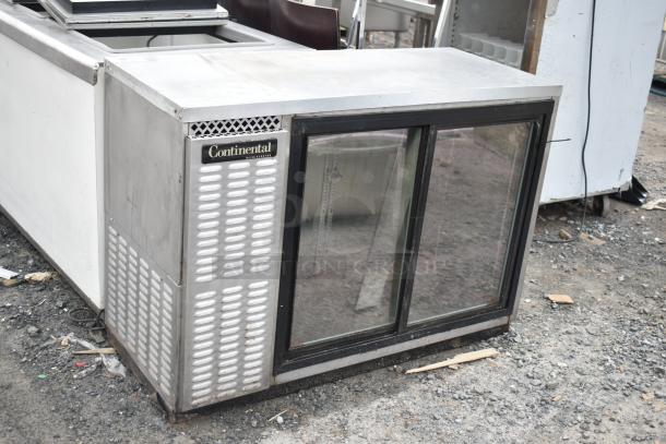 Continental BBUC50S-SS-SGD Commercial Back Bar Cooler, stainless steel, sliding glass doors, 115V, visible wear and dirt.