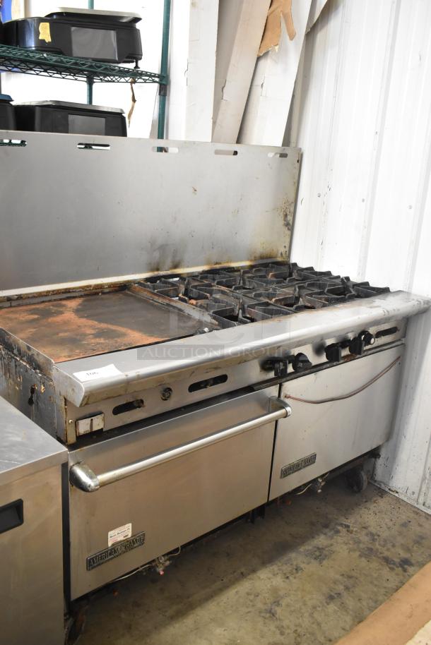 American Range commercial gas 6-burner range with flat top griddle, 2 ovens, backsplash. Used condition, visible marks.