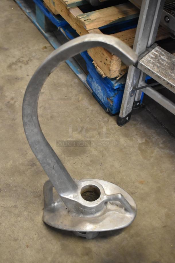 Four metal dough hooks for Hobart mixer, durable build, compatible with commercial mixer models, ideal for bakery use.