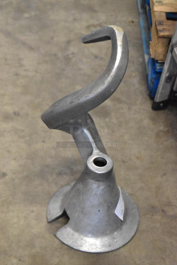 Four metal dough hooks for Hobart mixer, heavy-duty design, slightly worn, ideal for commercial baking use.