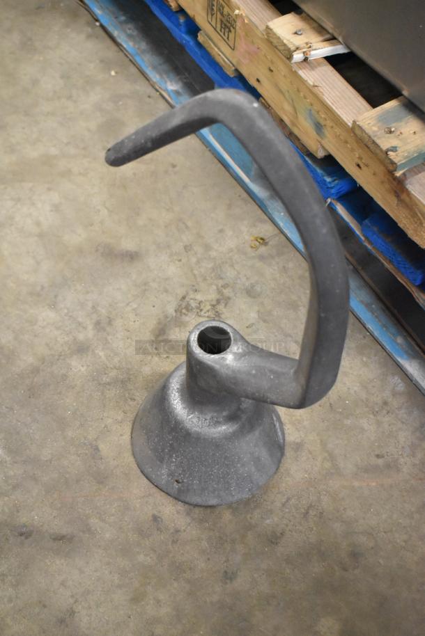 Four dough hook attachments for Hobart mixer, made of durable metal, good condition, ideal for commercial baking.