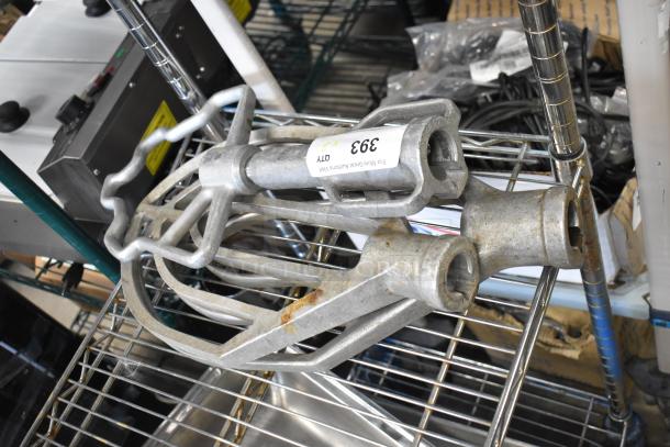Three Hobart mixer paddle attachments, stainless steel, in good used condition, with auction label 393 stating "3X."