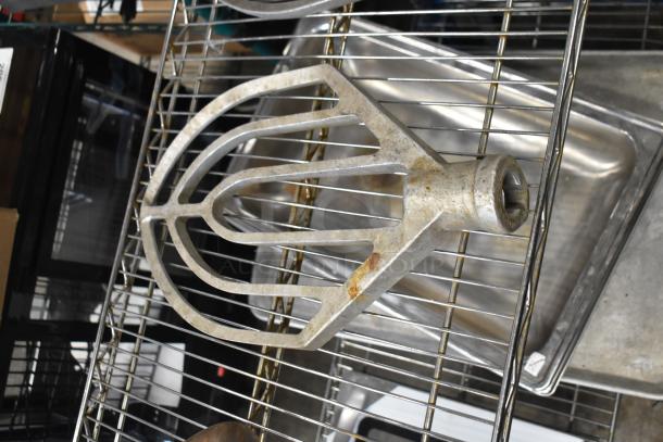 Three paddle attachments for Hobart mixer, metal, used condition with visible tarnish, ideal for bakery use.