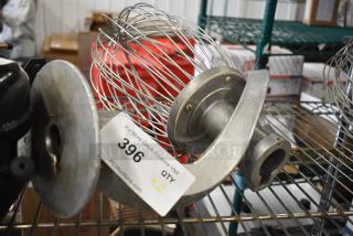 Two Hobart mixer attachments: dough hook and whisk. Visible tag shows auction info, item 396, bid multiplier x2.