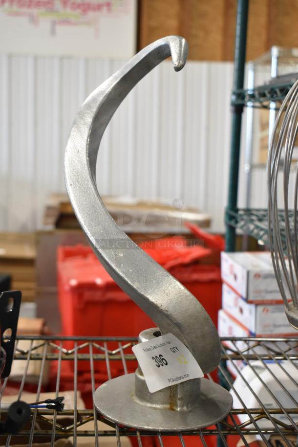 Dough hook attachment for Hobart mixer, metal, excellent condition. Includes whisk attachment. Auction tag visible.