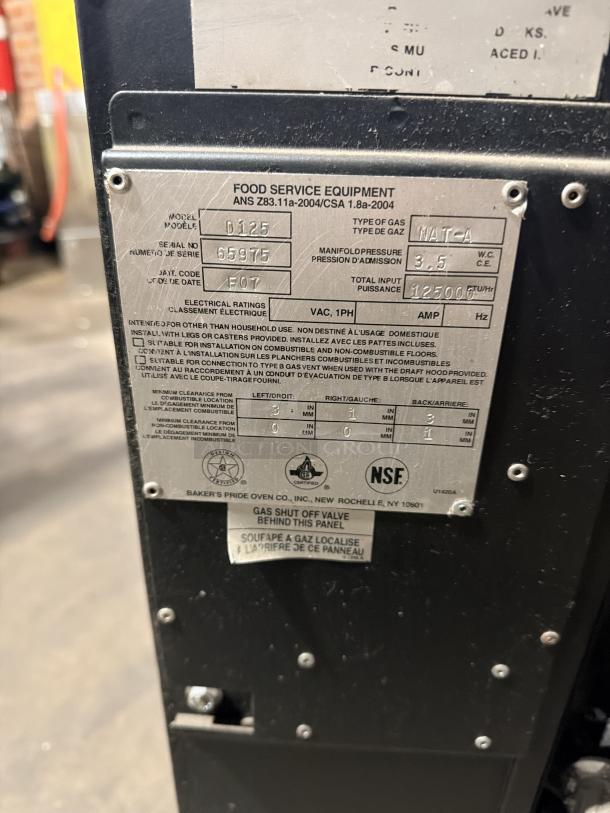 Bakers Pride FC-516/D125 pizza oven, stainless steel, natural gas, 1 phase, serial 65975, NSF certified, on legs.