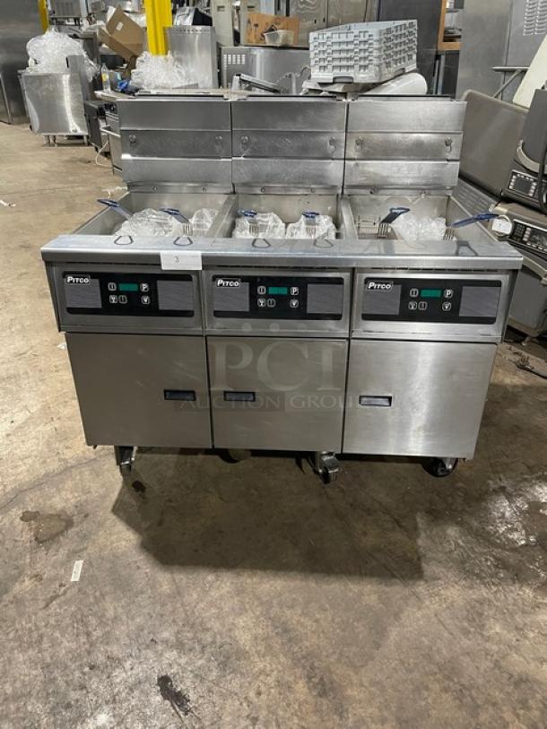 Pitco Frialator SG14JS triple-bay stainless steel fryer with digital controls, backsplash, and basket hanger on casters.