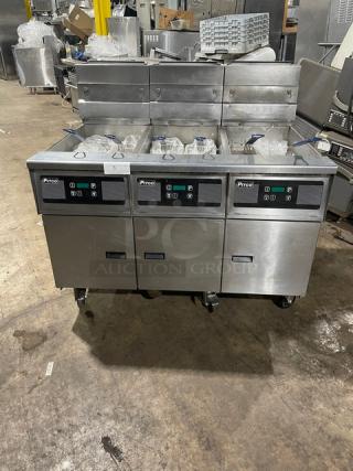 Pitco Frialator SG14JS triple-bay stainless steel fryer with digital controls, backsplash, and basket hanger on casters.