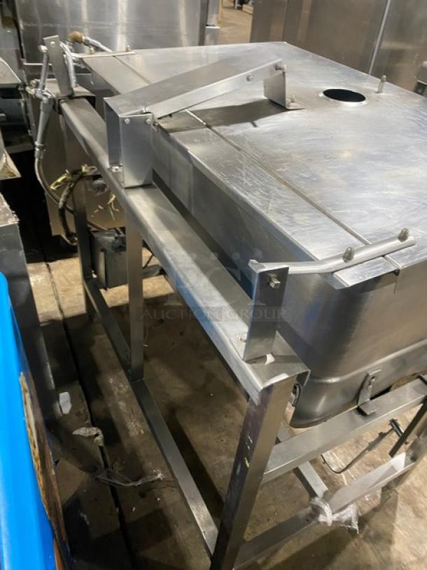 Groen commercial stainless steel 40 gal. tilt skillet, model NHFPE4, natural gas, 1 phase, with a single spout faucet on legs.