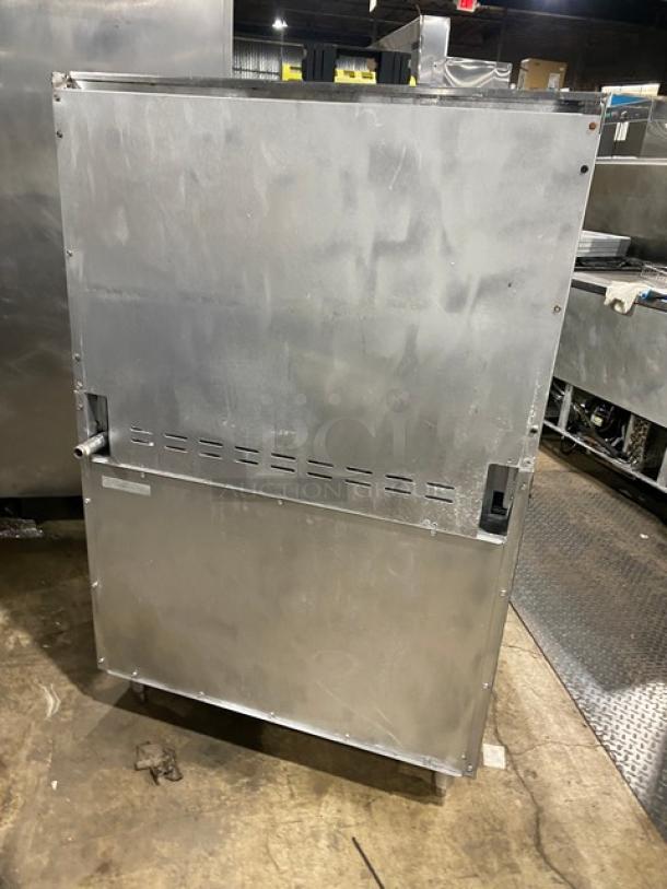 Tri-Star stainless steel 6-burner gas range/oven combo with backsplash, overhead salamander shelf, and wired oven rack.