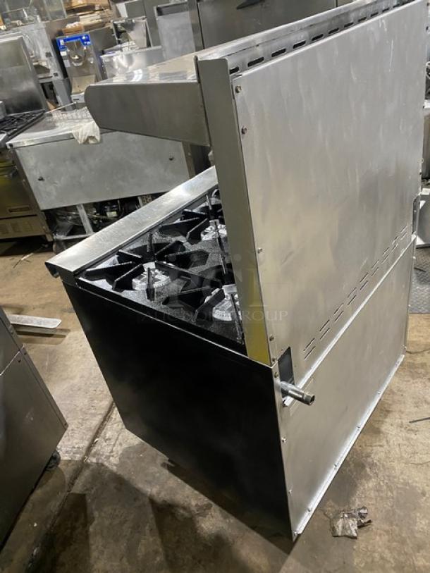 Tri-Star commercial stainless steel gas range/oven combo with six burners, backsplash, salamander shelf, and wired oven rack.