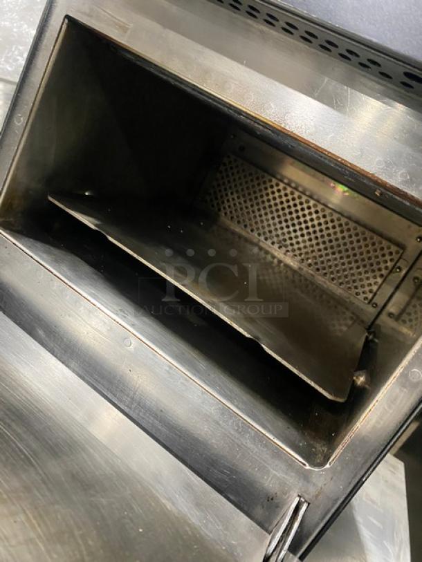 MerryChef black countertop rapid cook oven, electric-powered, late model, featuring high-speed cooking. Interior view shown.