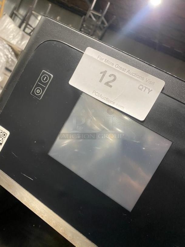 MerryChef black electric countertop rapid cook oven, late model. Touch controls visible. Auction tag reads "12".