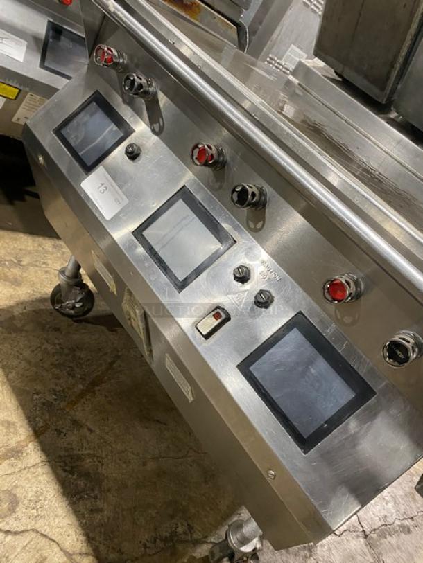 Taylor L813 stainless steel dual-sided griddle with programmable controls, model L813 SN M4026283, on casters.