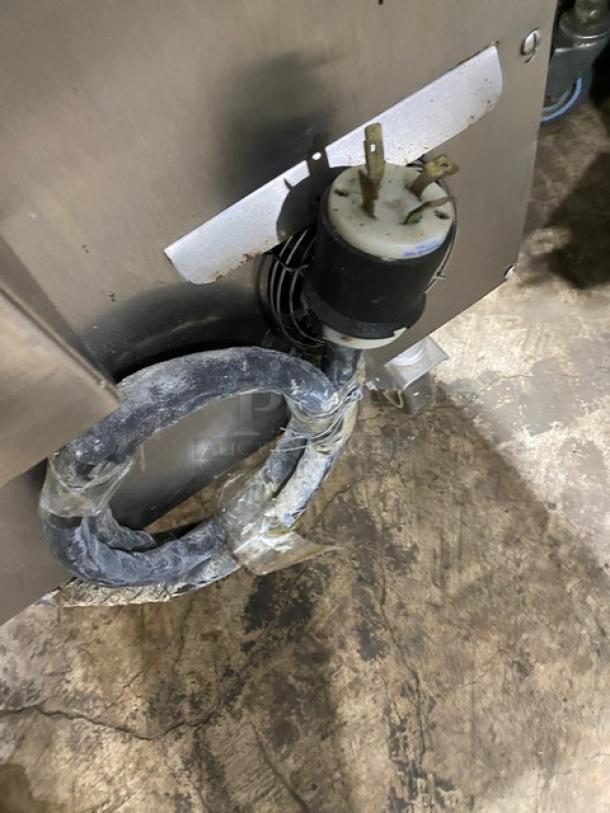 Taylor L813 stainless steel gas and electric griddle, double platen, 3-lane, on casters, showing power cord.