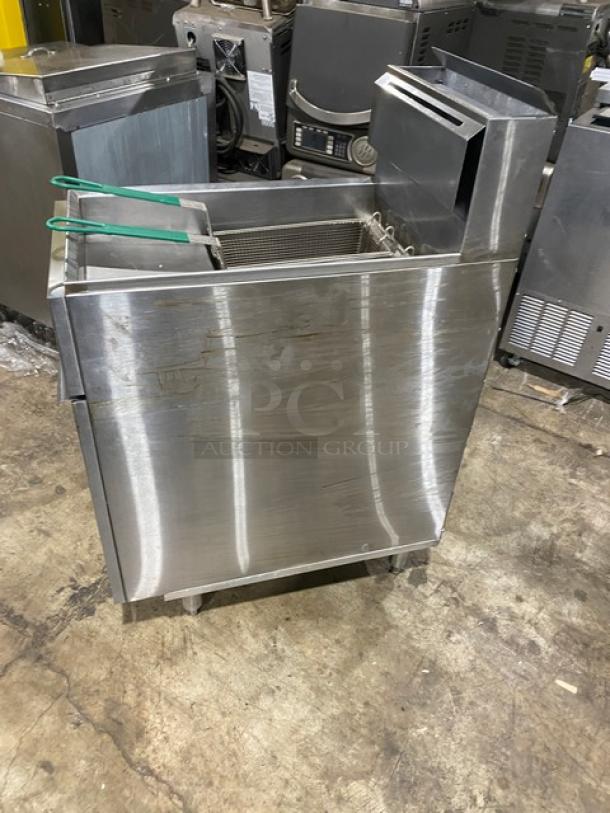 American Range stainless steel commercial gas deep fat fryer with back splash, basket hanger, and fry basket on legs.