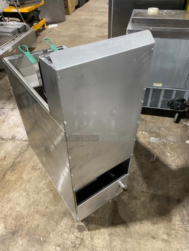 American Range commercial stainless steel gas deep fat fryer with backsplash, basket hanger, and fry basket, on legs.