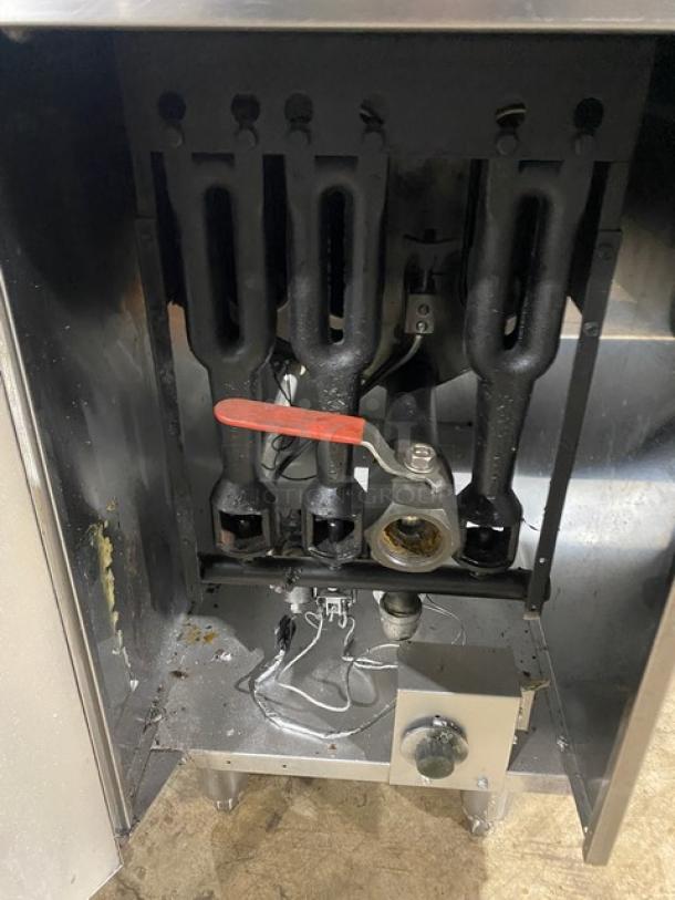 American Range commercial stainless steel gas deep fat fryer, with back splash, basket hanger, fry basket, on legs.