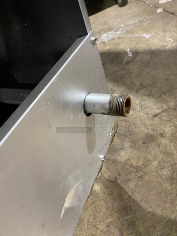 American Range commercial stainless steel gas deep fat fryer. Features a backsplash, basket hanger, and fry basket. On legs.