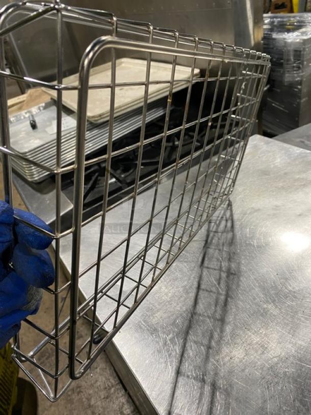 Commercial chrome-plated full-size bagel/pastry wired rack in good condition. Durable structure shown on stainless steel surface.