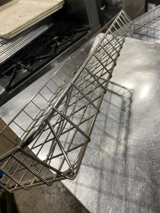 Commercial chrome plated full-size wire rack for bagels/pastries, in good condition, showing metal grid design.