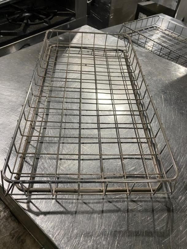 Commercial chrome-plated full-size bagel/pastry wired rack, sturdy metal grid, pristine condition, ideal for bakery display.