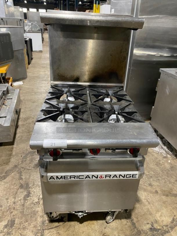 American Range commercial stainless steel 4-burner range/oven with backsplash, overhead salamander shelf, and wired oven rack.