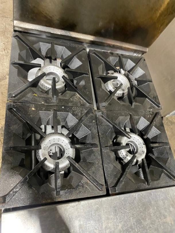 American Range commercial stainless steel 4-burner range/oven combo with backsplash, overhead salamander shelf, and wired oven rack.