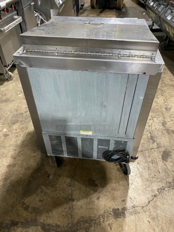 Beverage-Air SP27 stainless steel refrigerated prep table on casters, with poly-coated wire rack, 115V, single door.
