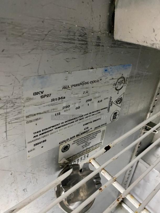 Beverage-Air SP27 single door refrigerated salad prep table, stainless steel, on casters, with poly-coated rack. Serial: 8108534.