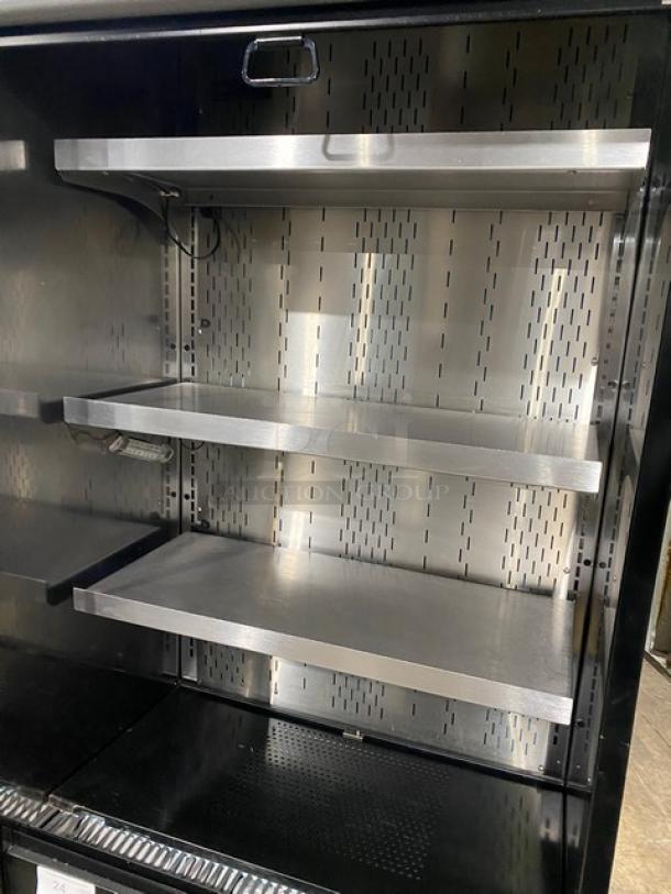 Structural Concepts Oasis Series refrigerated merchandiser, model B32, with three shelves and pull-down night curtain.