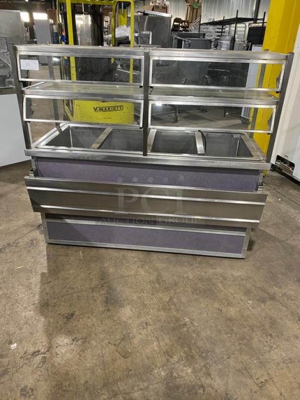 Atlas Metal stainless steel buffet-style refrigerated salad bar, Model WCMBT4, 60", 4 wells, sneeze guard, tray slide, storage below, on casters.