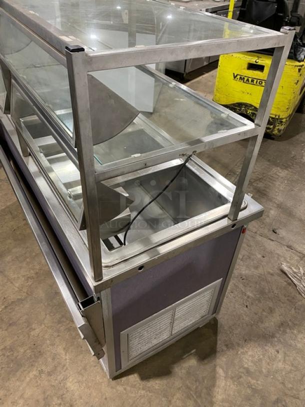 Atlas Metal 60" buffet style refrigerated cold food salad bar, stainless steel, with sneeze guard, tray slide, and storage cabinet, Model WCMBT4.