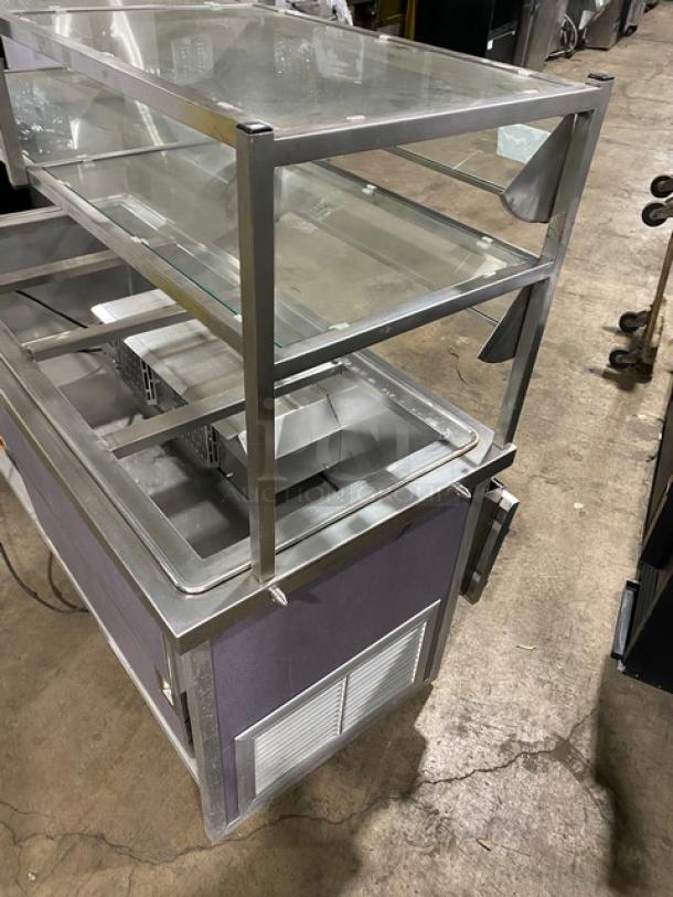 Atlas Metal WCMBT4 stainless steel 60" refrigerated salad bar with sneeze guard, tray slide, and storage cabinet. On casters.