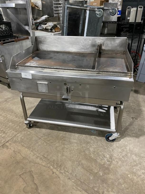 WoodStone stainless steel natural gas countertop split top plancha griddle, model WSPL48364CT00NG, with splash guards and undershelf cart.