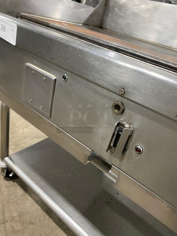 WoodStone WS-PL-4836-4-CT00NG stainless steel griddle with backsplash, undershelf, casters, and red indicator lights.