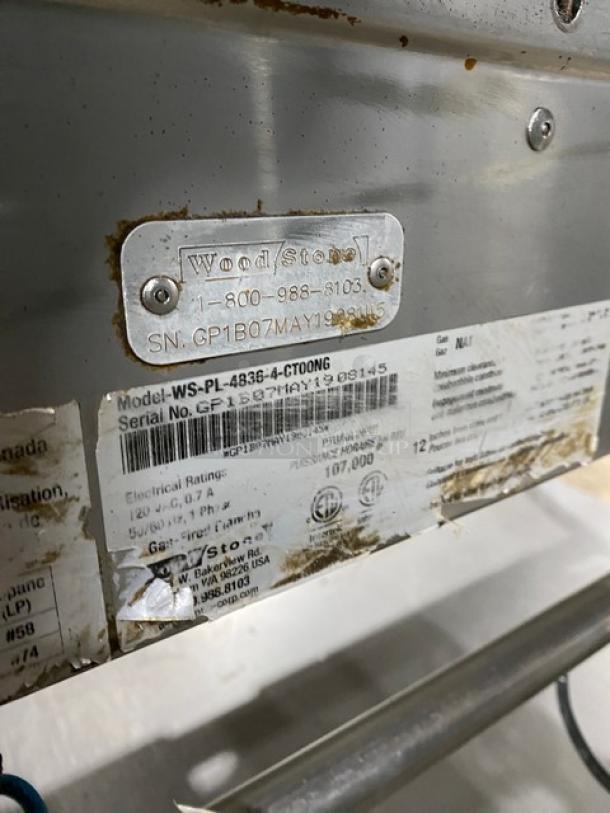 WoodStone commercial stainless steel natural gas griddle, model WS-PL-4836-4-CT00NG, with tags showing serial number GP1B07MAY1908145.