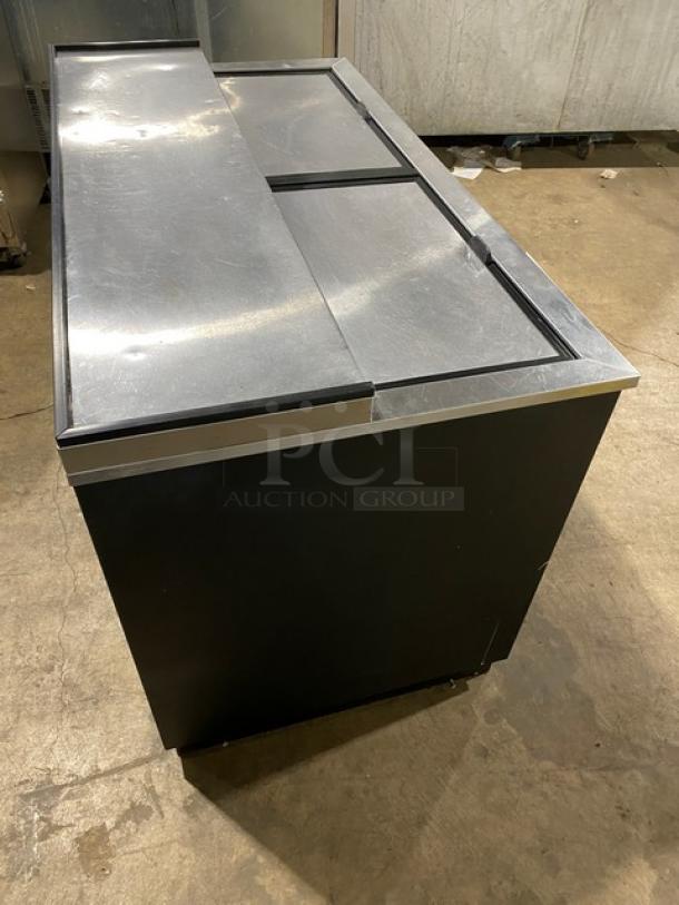 True Commercial 50" black bottle cooler, model TD5018, with stainless steel worktop and dual slide lid. Condition: good.