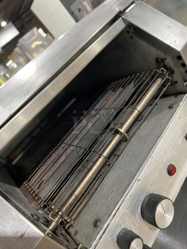 Hatco Toast-Qwik Series stainless steel conveyor toaster, commercial-grade, electric-powered. Control knobs visible.