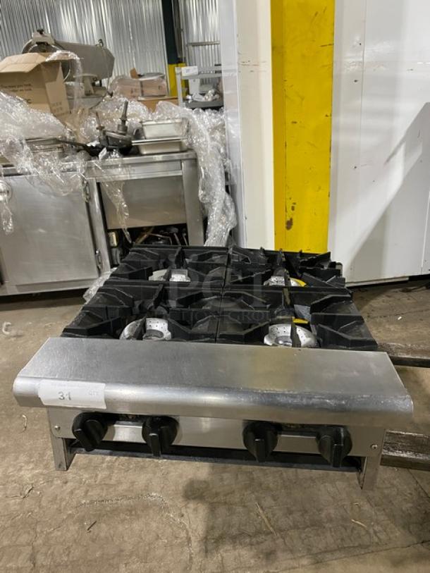 American Range stainless steel gas-powered 4-burner countertop range in good condition; commercial use.