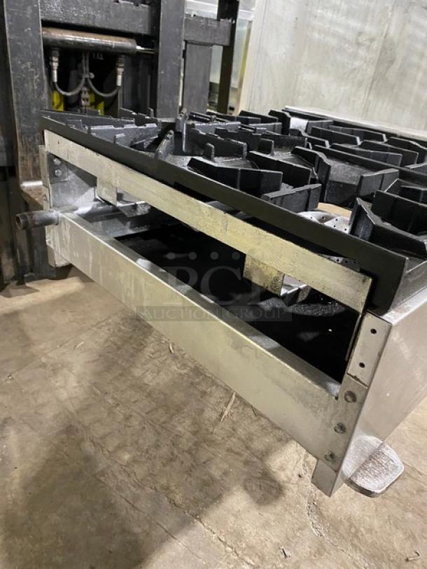 American Range commercial stainless steel gas-powered countertop 4-burner range. Features durable cast iron grates. Used condition.
