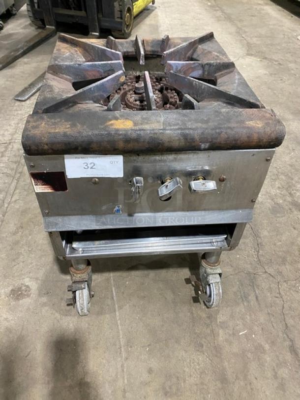 U.S. Range natural gas stock pot burner on casters, rugged metal frame, used condition, control knobs visible, tagged "32 QTY."