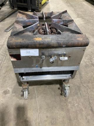 U.S. Range natural gas stock pot burner on casters, rugged metal frame, used condition, control knobs visible, tagged "32 QTY."