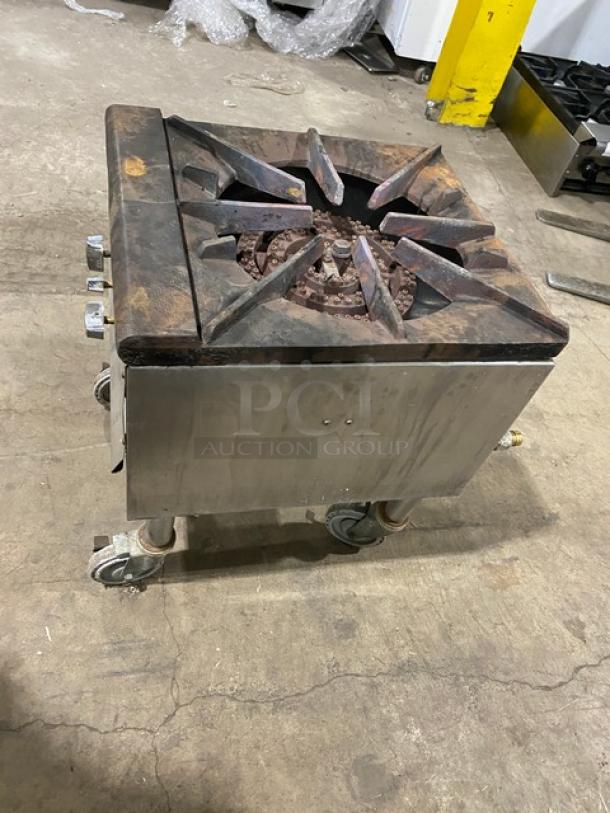 U.S. Range natural gas-powered single burner stock pot range on casters, used condition, stainless steel body, visible gas knobs.