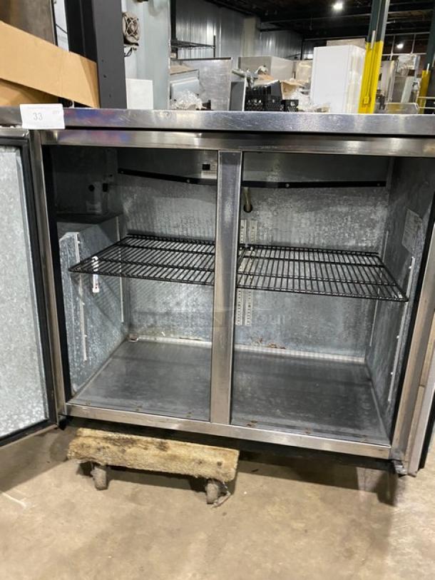 True commercial stainless steel 2-door back bar cooler, model TBB-24-48S. Features black coated wired rack, 115V 1-phase.