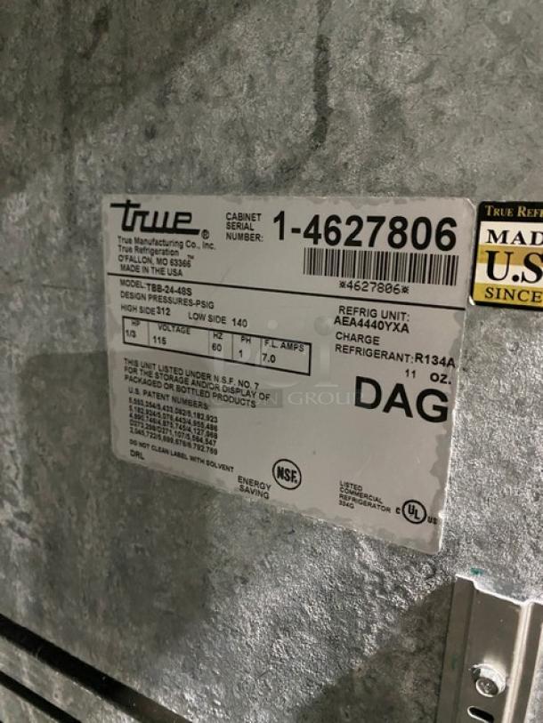 True commercial stainless steel 2-door back bar cooler, Model TBB-24-48S. SN: 1-4627806, with black coated wire rack.