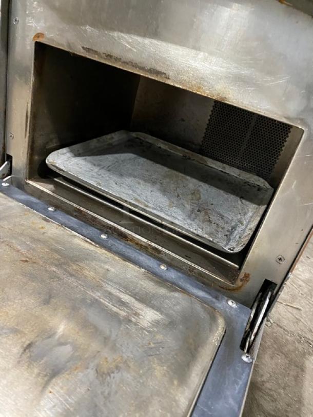 TurboChef NGO commercial rapid cook countertop oven with digital controls, on legs. Visible wear and metal interior.