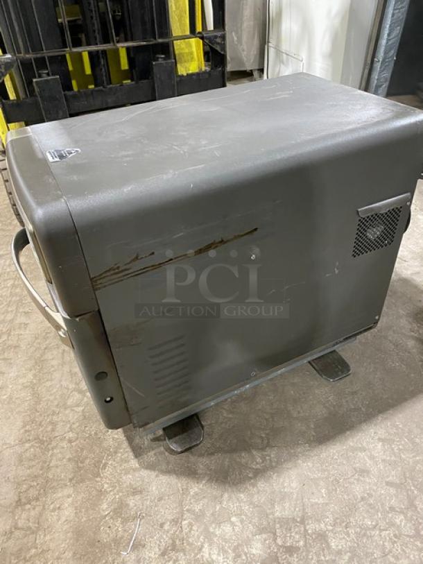 TurboChef NGO commercial rapid cook oven, electric countertop model on legs, with digital push controls, visible wear.